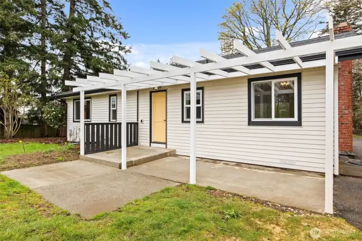 The back of the house offers plenty of space to sit out for a BBQ or enjoying the sunshine.