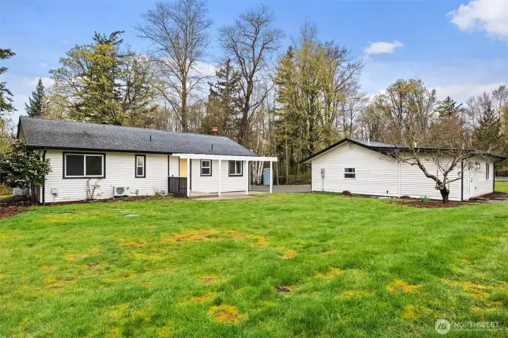The back of the property from the corner looking towards garage and additional living space
