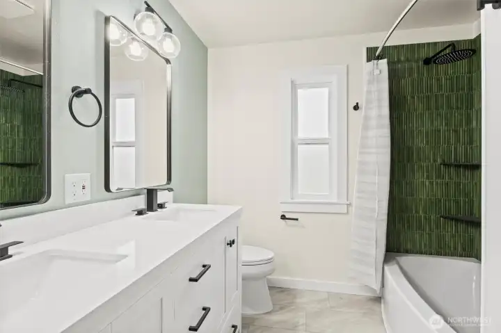 Spacious bathroom even has two shower heads and double sinks!