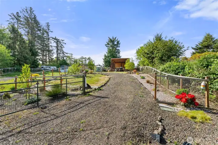 Second lot, buildable. has own driveway. RV cover and hookups on this lot.