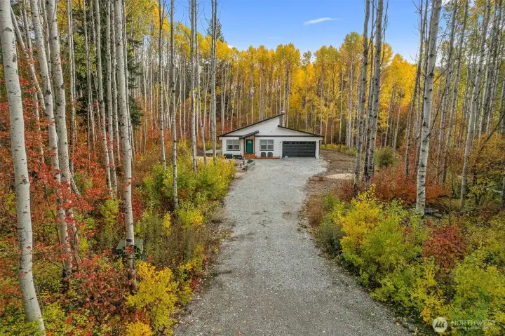 Unlike many mountain properties where neighboring homes or roadways remain visible, the rear of the property is defined by open space, mature trees, and a calming natural backdrop that changes beautifully with the seasons.
