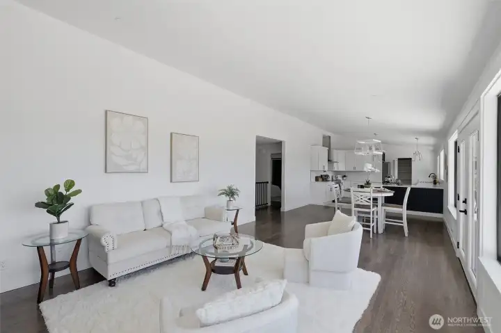 Spacious open-concept living room, dining area, and kitchen.