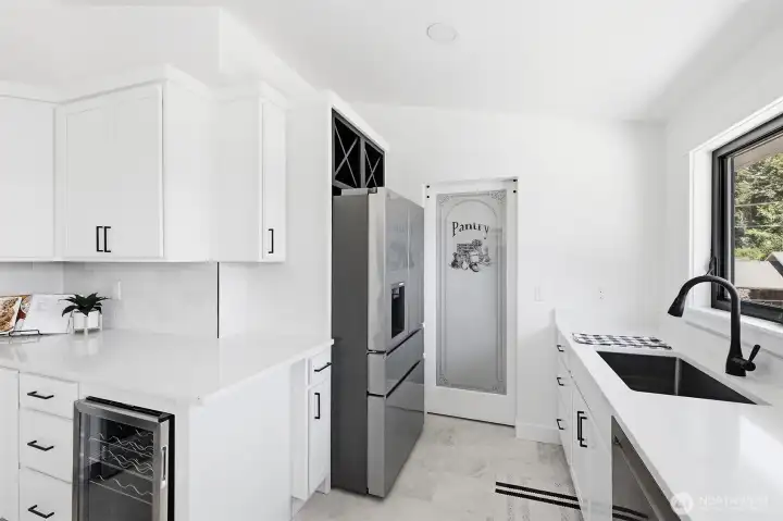 Spacious, modern kitchen featuring high-end appliances and a thoughtful, functional layout.