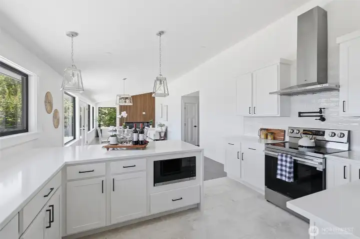 Open-concept kitchen area with a spacious layout, perfect for entertaining and enjoying clear views of the home.
