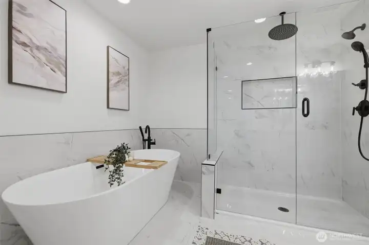 Relax in the free-standing soaking tub, perfect for unwinding after a long day.
