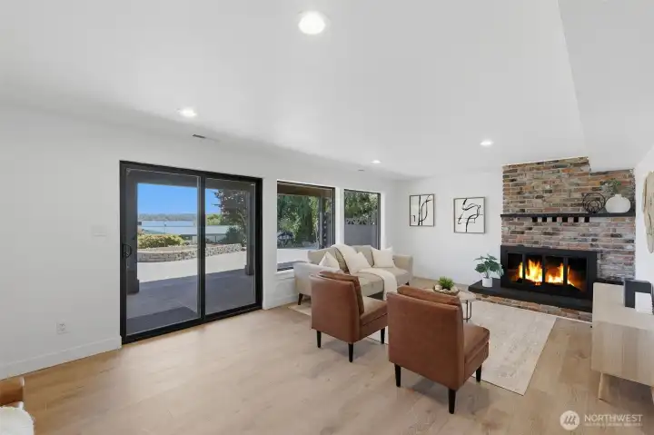 Family room with seamless access to the lower covered patio, perfect for enjoying the scenic views.