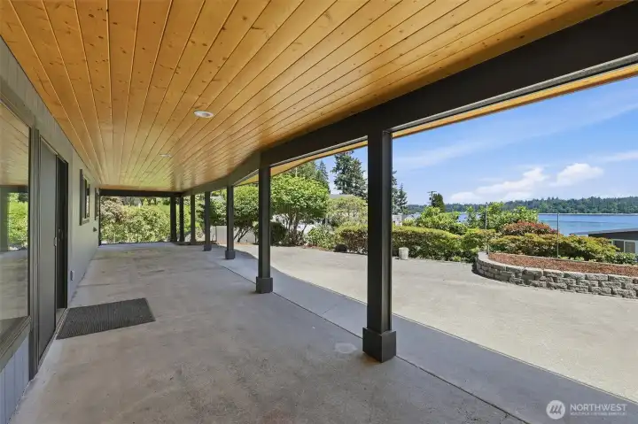 Covered lower patio with year-round outdoor living space.
