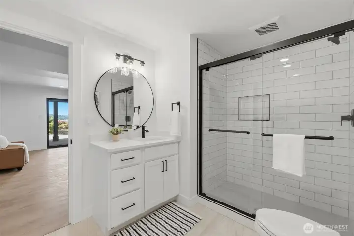 Spacious lower-level bathroom with premium finishes.