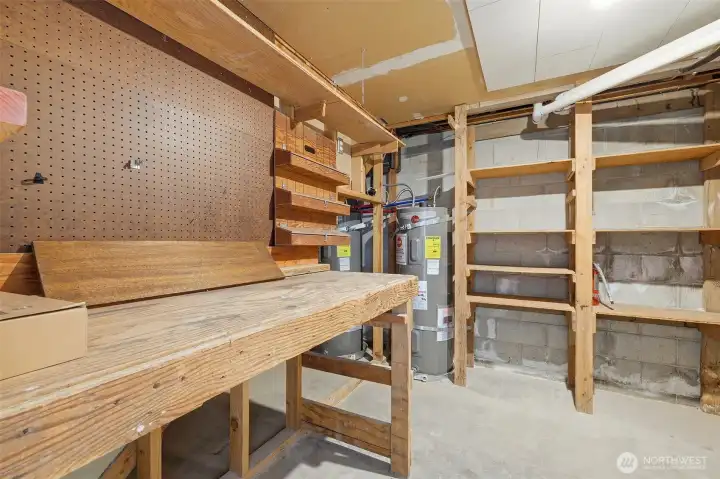 Spacious lower-level storage and dedicated workspace area.