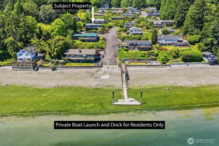 Aerial view showcasing the property's proximity to the boat launch and private dock.