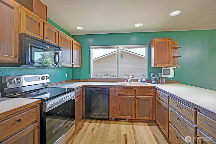Large and spacious kitchen offers plenty of storage space and counter tops.