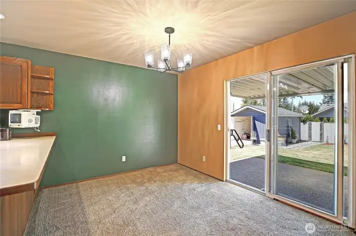 Dining room leading out to the backyard and covered patio.