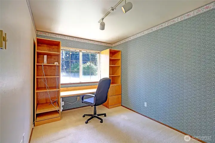 Additional room can be used as an office, den or additional living space.