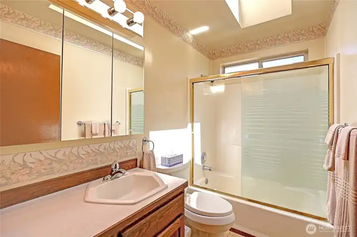 Guest bathroom just off the guest bedroom and additional office/room.