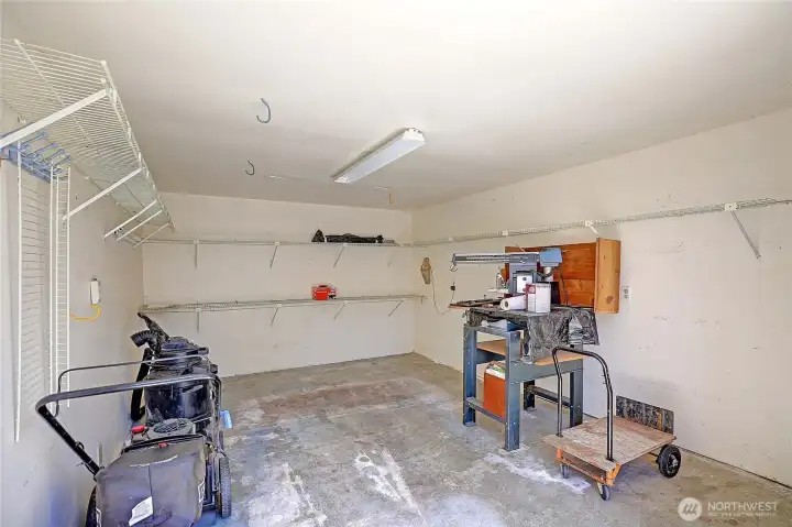 View of the backyard shed with electrical outlets offers room for your golf cart or other outdoor items.