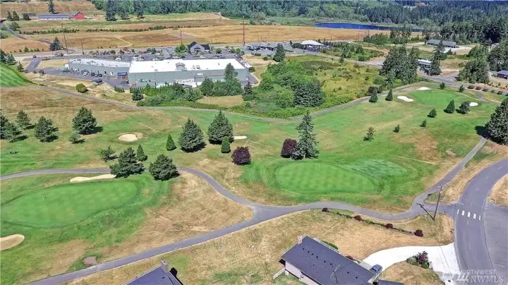 Aerial view showing the proximity to the local grocery store, hardware store, and local pub.  Take your golf cart or enjoy a short walk.