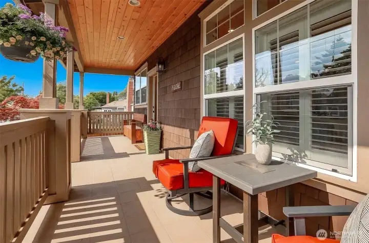 A welcoming front porch provides a peaceful setting for morning coffee, evening sunsets, and relaxed conversations with neighbors.
