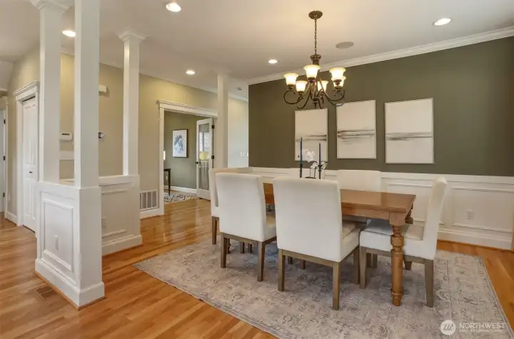 Beautiful hardwood floors extend throughout the entire main level, adding warmth and creating a seamless flow from room to room.