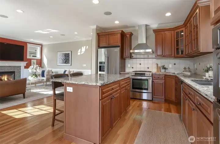 Designed with an open, connected layout, the kitchen serves as the central gathering space of the home.
