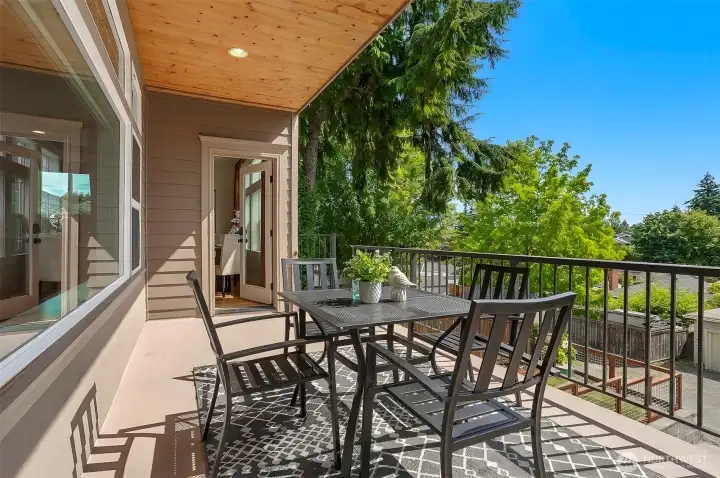 The expansive deck off the kitchen provides an exceptional outdoor living experience, perfect for enjoying a morning coffee at sunrise, alfresco dining, and effortless entertaining.