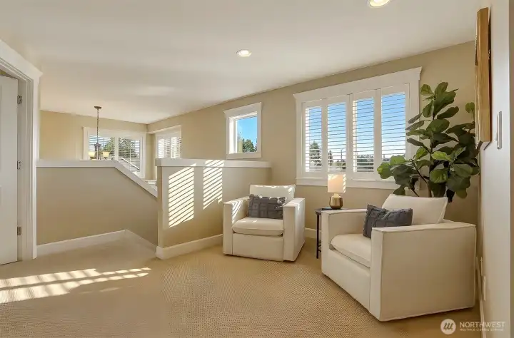 The generous top-floor landing adds valuable flexibility, with room for a quiet reading nook, home office, or dedicated workout space.