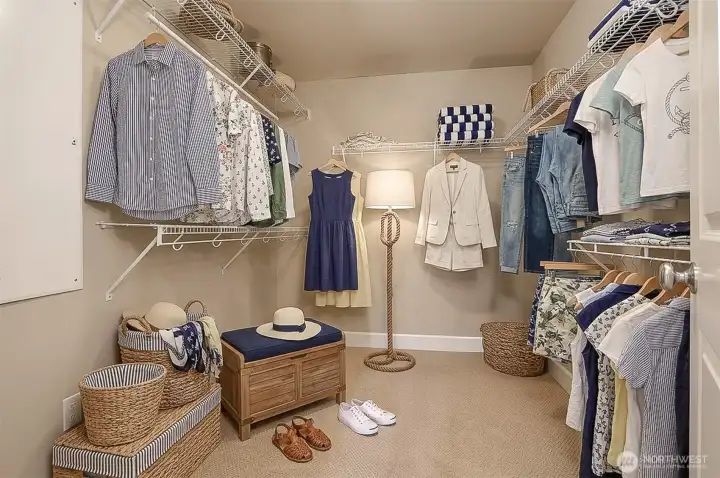 Primary bedroom walk-in closet (virturally staged).