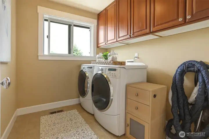 A top-floor laundry room is conveniently located near all bedrooms for added ease and efficiency.