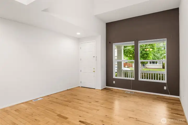 Spacious main floor room with neutral tones and plenty of natural light. Spacious main floor room with neutral tones and plenty of natural light.