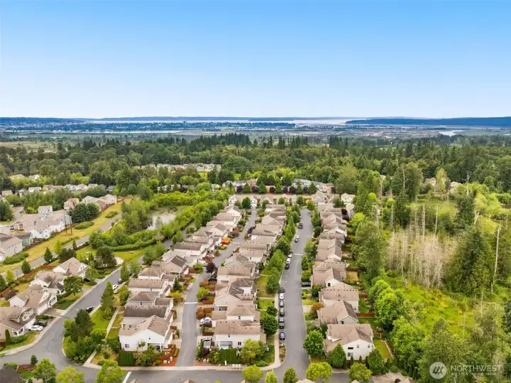 Aerial view of nearby streets and homes. Aerial view of nearby streets and homes.