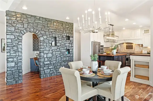 Behind the stone wall is the office nook, complete with a built-in wine rack.