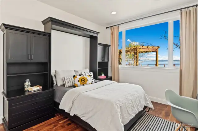 With the built-in Murphy bed and drawers, this lower level bedroom can be a flex room!