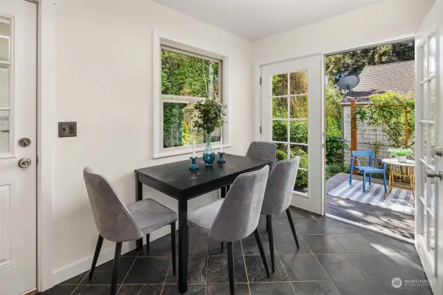 The eat-in dining space can be extended to the sun deck through these gorgeous French doors.