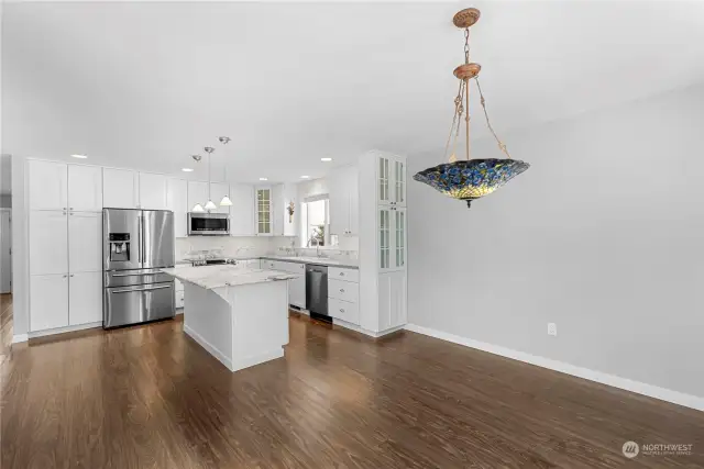 Custom cabinetry includes the display cabinet at the end of the countertop.