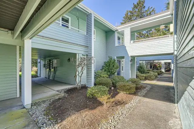 From the garage, take the walkway to the front door of the unit on your left.