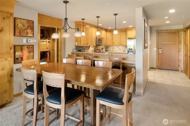 Large dining room table and breakfast bar.