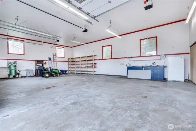 3 large garage bays. Mower does not convey.