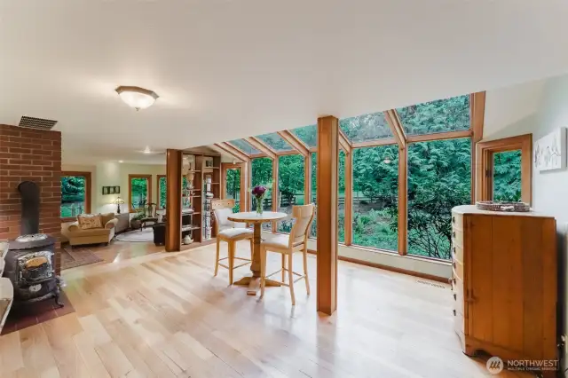 Enjoy breakfast and quiet time under the wood framed sunroom that faces south.
