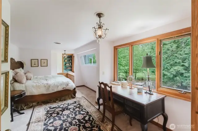 The primary bedroom is designed to take in the beauty and calm of the landscape.