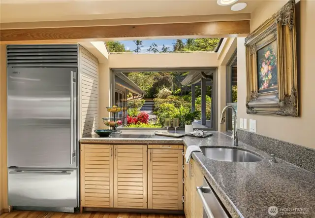 Kitchen overlooks private Asian courtyard garden