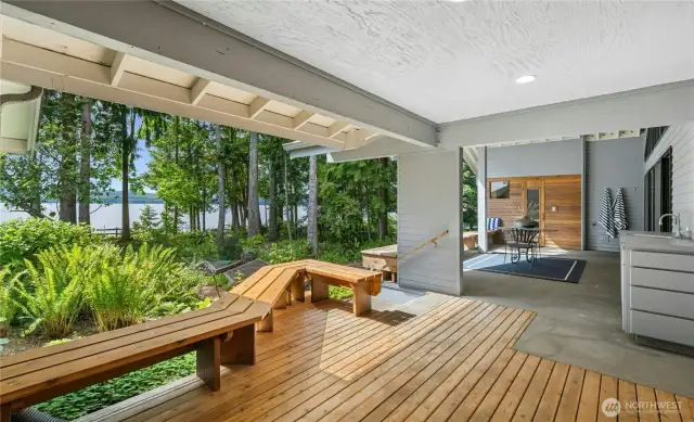 Covered deck off the Billiards Room with outdoor kitchen and sink.