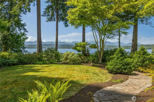 Lush NW gardens with pathway to the beach stairs