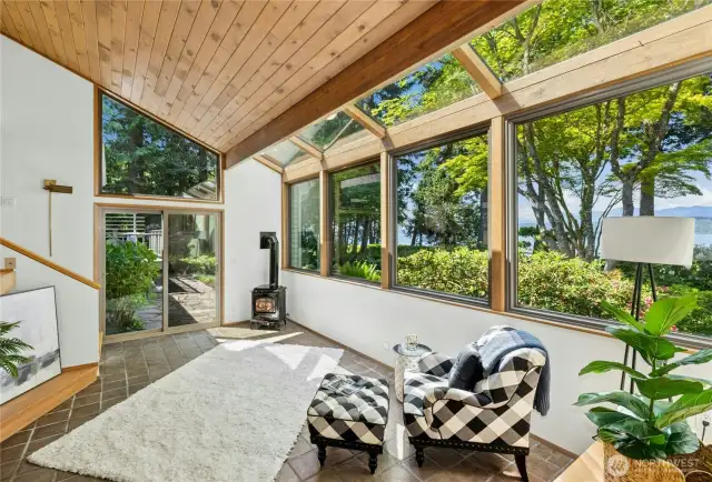 Sunken sunroom with cozy propane fireplace