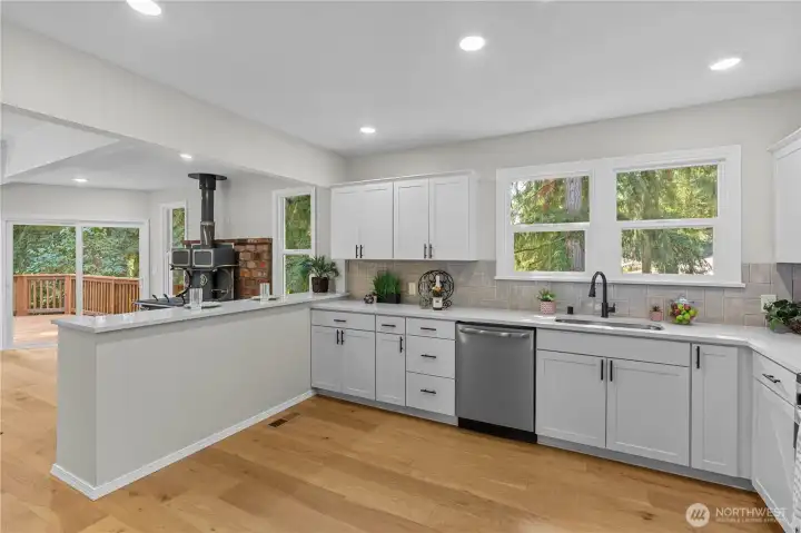 Spacious Kitchen w/White Cabinets, Stainless Steel Appliances and even a Breakfast Bar, for those quick bites.
