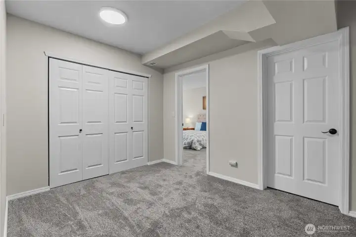 This is the Bonus Room space. The Laundry and Cellar are off this space. It's large enough to make another Office or Play Room, too!
