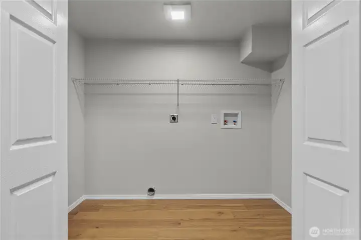 Off the Bonus Room is this oversized Laundry Closet. Wire Shelving will help you keep all your necessities organized!