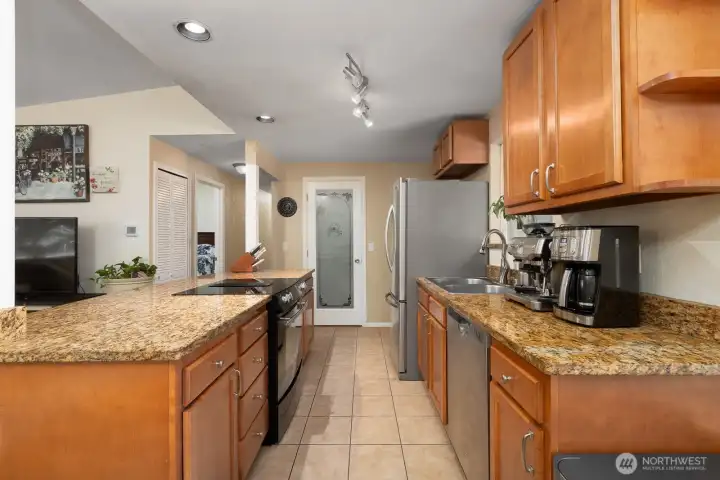 Kitchen features granite counters and stainless appliances.