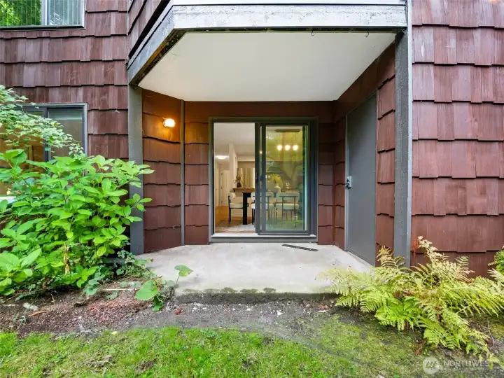 Private patio with a creek below, and views of cherry blossoms in the spring right out your living room window!