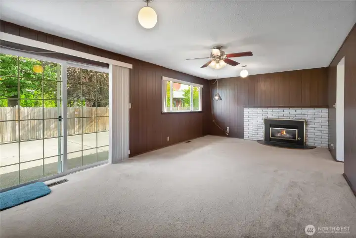 Virtually staged to show possibilities. Second living room / bonus room with sliding glass door leading to patio and fully fenced backyard.