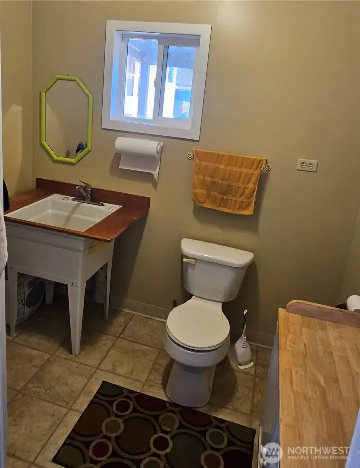 Shop 1/2 bath with utility sink.