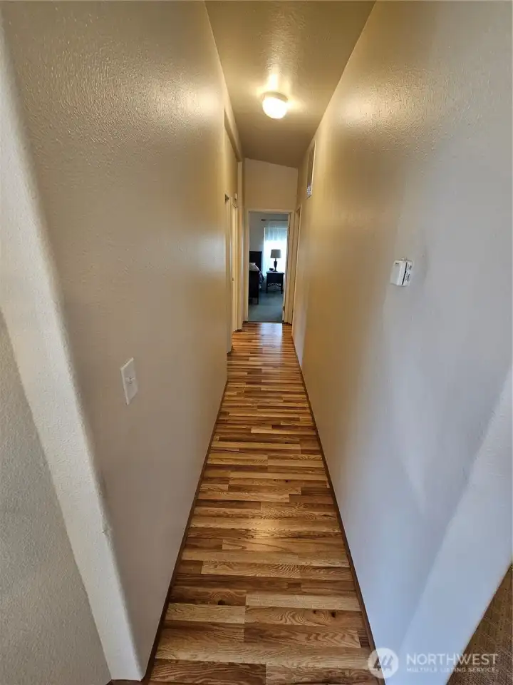 The long hallway takes you to the bedrooms, utility room and bathrooms.
